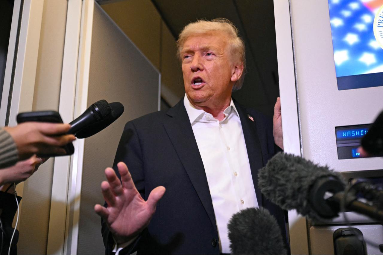 US President Donald Trump speaks with the press on board Air Force One in Mildenhall, Suffolk on October 14, 2025. (AFP Photo)