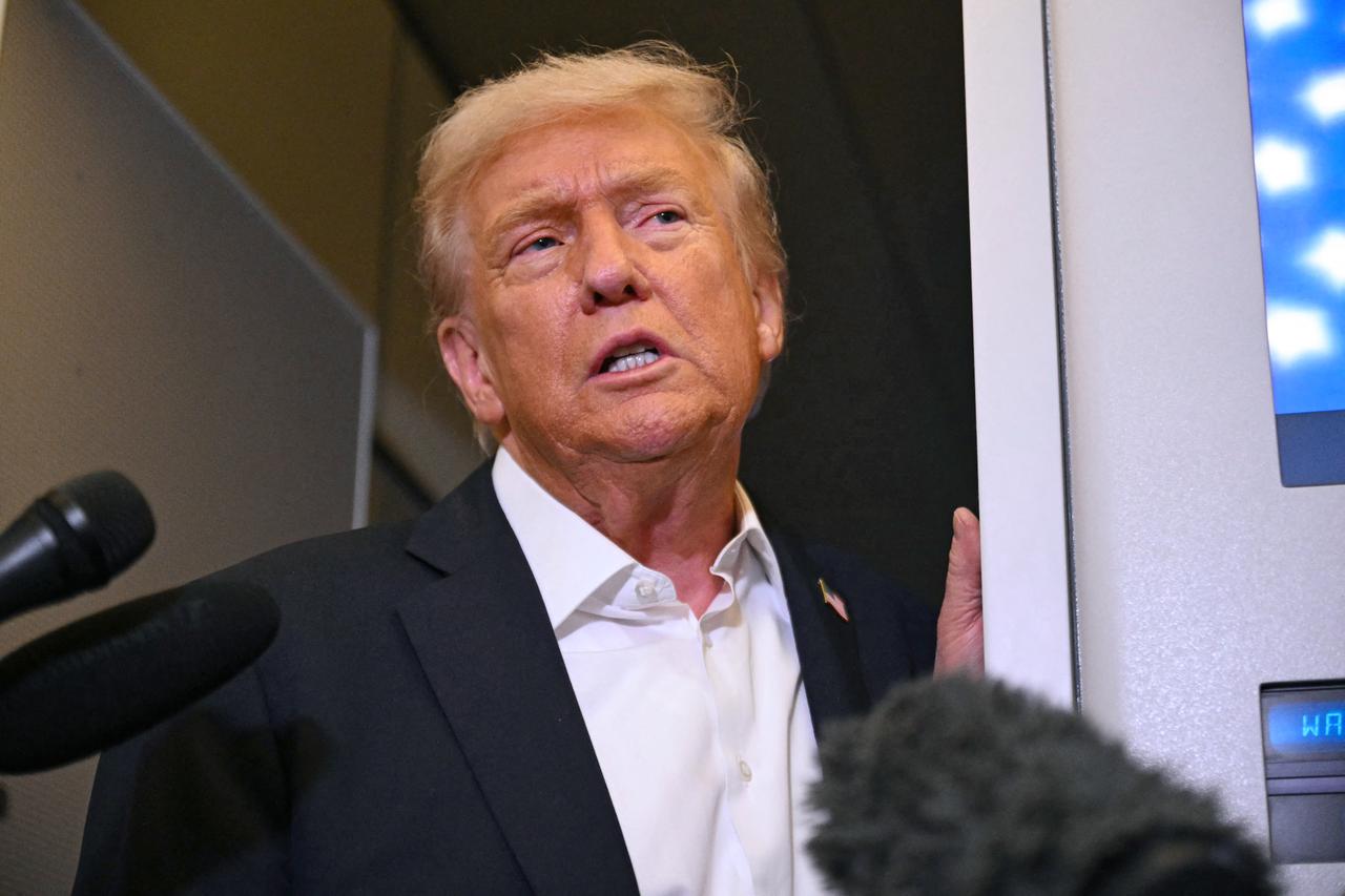 US President Donald Trump speaks with the press on board Air Force One in Mildenhall, Suffolk, on October 14, 2025. (AFP Photo)