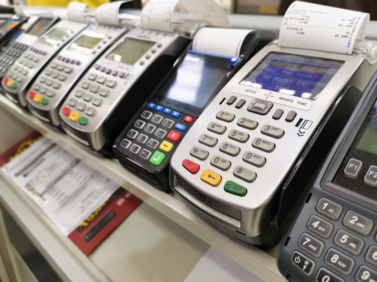 File photo shows point-of-sale (POS) terminals at a retail counter. (Adobe Stock Photo)