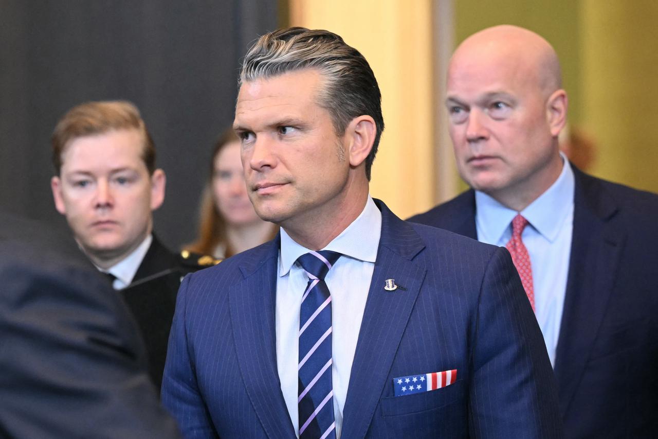 US Defense Secretary Pete Hegseth, flanked by US Ambassador to NATO Matthew Whitaker (R) in Brussels on October 15, 2025. (AFP Photo)
