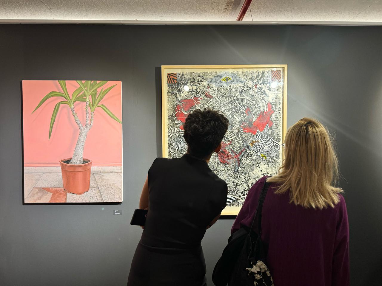 Art enthusiasts examine pieces on display during the opening of Artweeks Istanbul, which brings together galleries, artists, and institutions from across Türkiye, Oct. 15, 2025. (AA Photo)