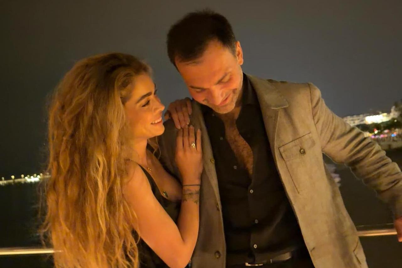 Oyku Celik and Ali Cakici seen smiling together in an evening photo shared after the marriage proposal. (Photo via Instagram/@oykucelikk_)
