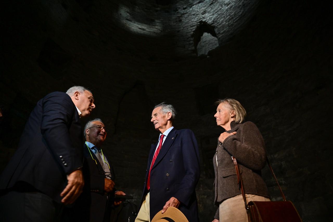 Count Nikolai Tolstoy and his wife Georgina Tolstoy listen to officials inside one of the dungeon towers of Yedikule Fortress during their visit in Istanbul, Oct. 16, 2025. (AA Photo)