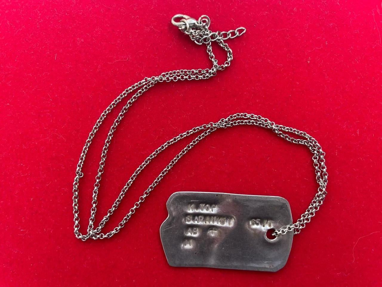 A military dog tag belonging to Kudret Top, unearthed during excavations at ancient city of Attouda in Denizli, Türkiye, Oct. 16, 2025. (IHA Photo)