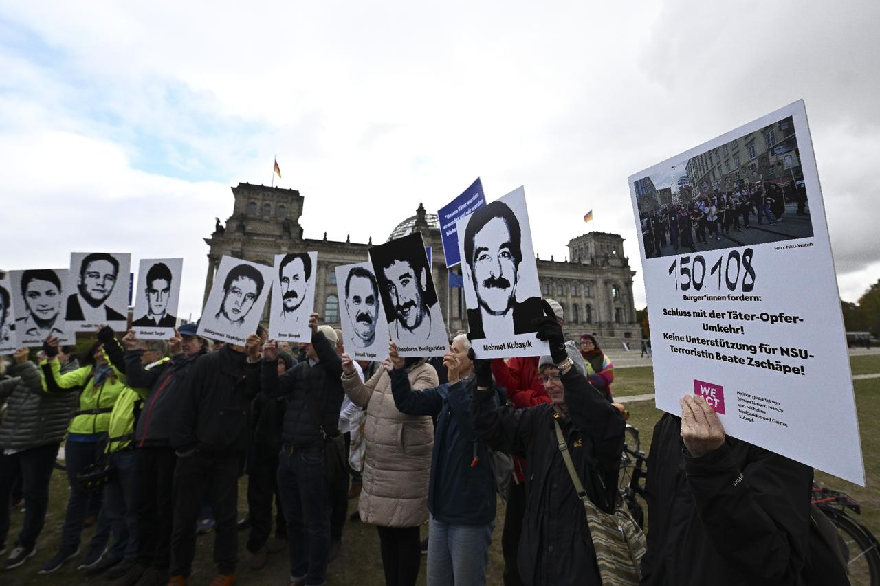 Families of the victims of NSU murders - Semiya Simsek, Gamze Kubasik, Mandy and Michalina Bulgarides - along with others, gather in front of the German Bundestag in Berlin, Germany, Oct. 17, 2025. (AA Photo)