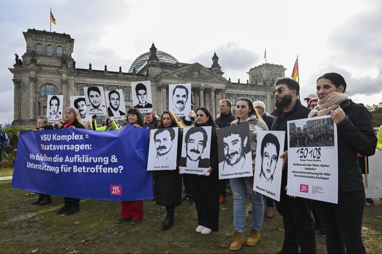 Families of the victims of NSU murders - Semiya Simsek, Gamze Kubasik, Mandy and Michalina Bulgarides - along with others, gather in front of the German Bundestag in Berlin, Germany, Oct. 17, 2025. (AA Photo)