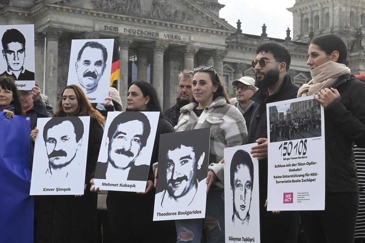 Families of the victims of NSU murders - Semiya Simsek, Gamze Kubasik, Mandy and Michalina Bulgarides - along with others, gather in front of the German Bundestag in Berlin, Germany, Oct. 17, 2025. (AA Photo)