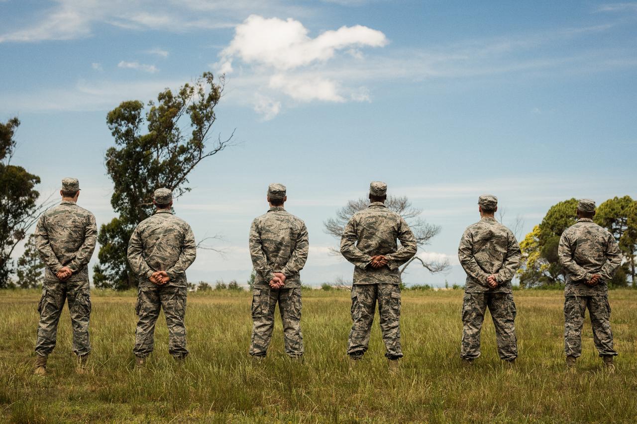 Military personnel standing in organized rows. (Adobe Stock Photo)