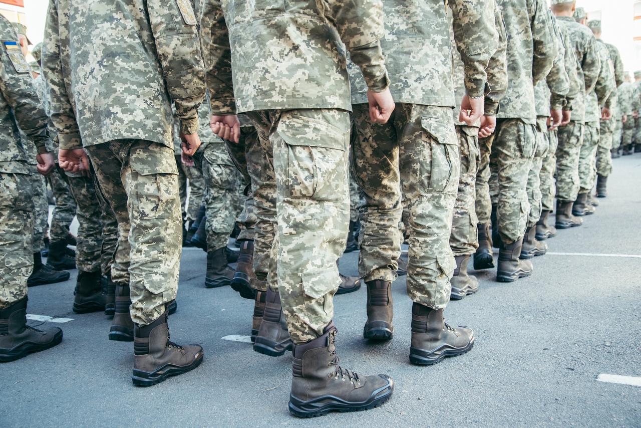 Soldiers stand in formation during a military parade. (Adobe Stock Photo)