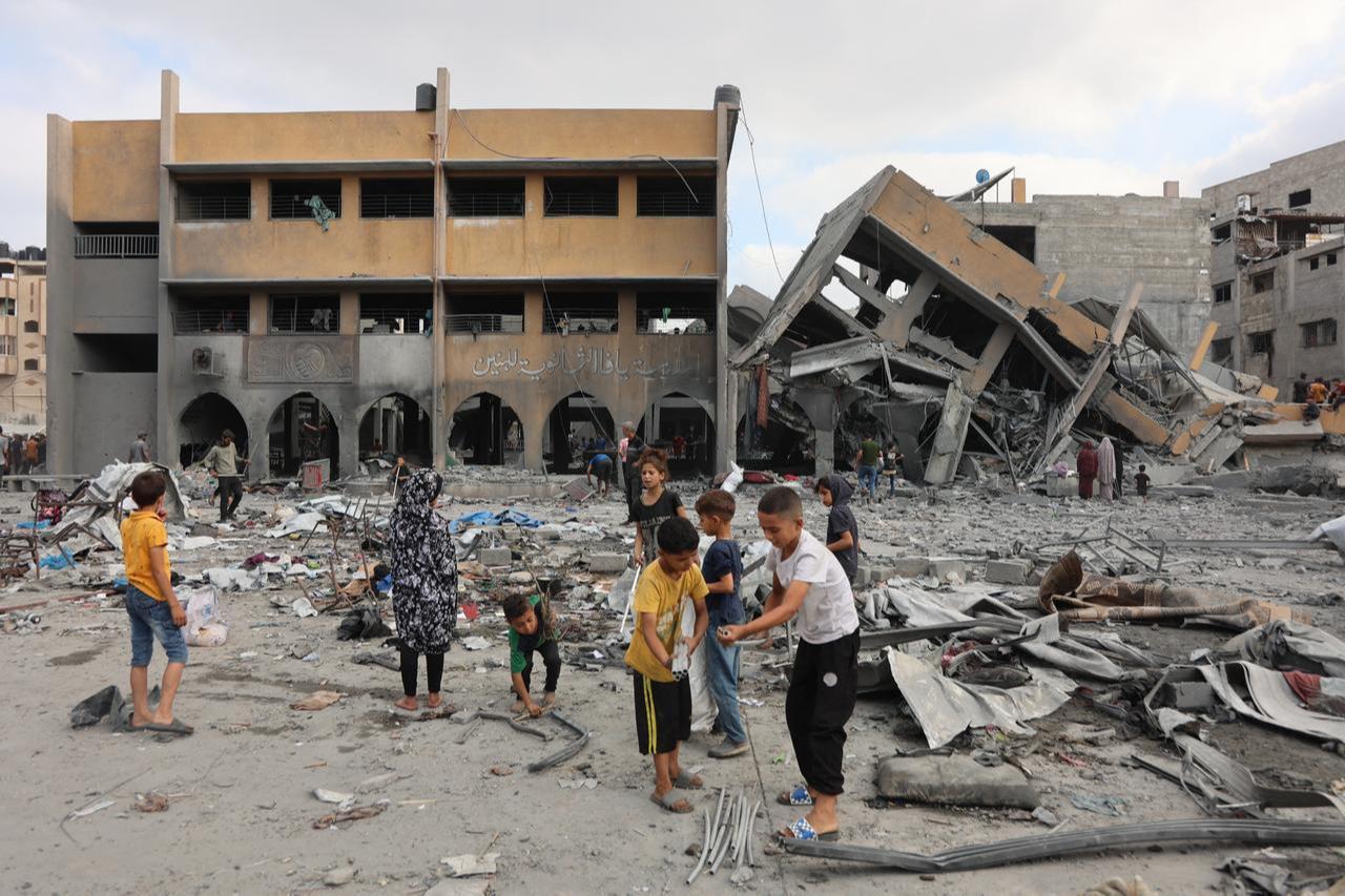Palestinian children check the rubble in the vicinity of Yaffa School in the Tuffah neighbourhood of Gaza City following overnight Israeli strikes, on June 30, 2025. (AFP Photo)