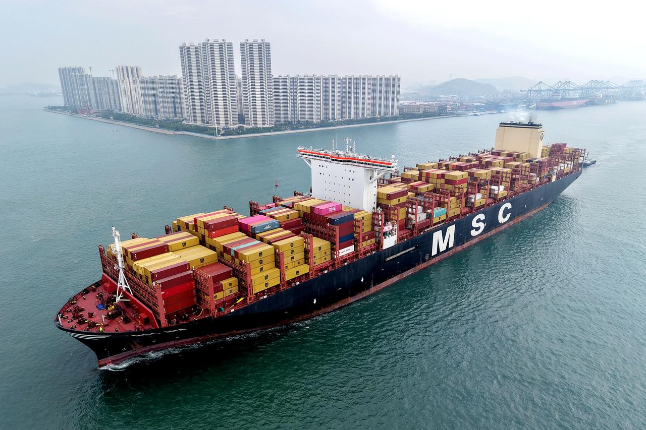 This aerial view shows a container ship moving towards its berth at the container terminal of the port in Qingdao, in Chinas eastern Shandong province, on Sept. 24, 2025. (AFP Photo)