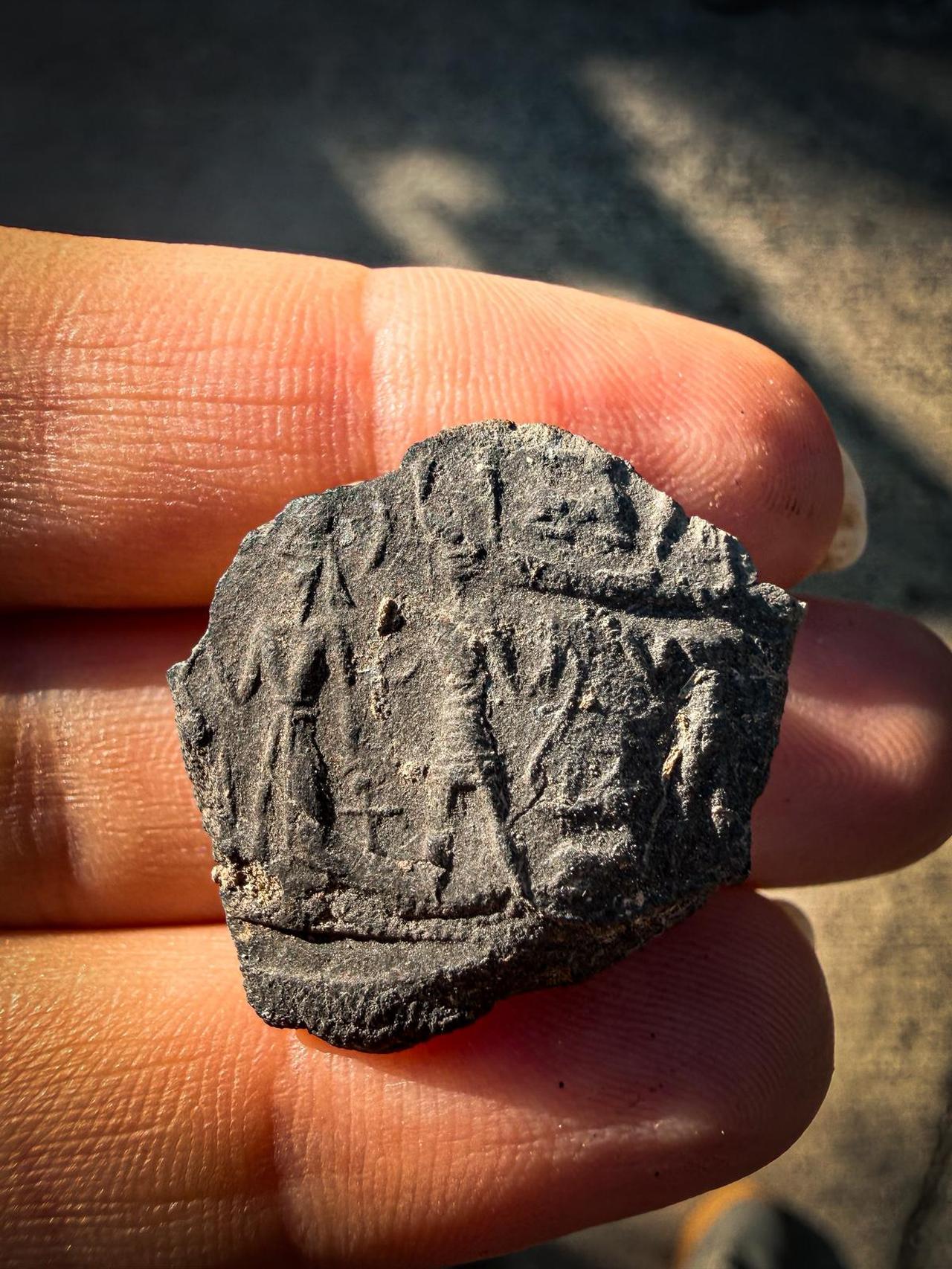 A cuneiform tablet dating back to 1500-1400 BC, unearthed during excavations at Accana Mound in the Reyhanli district of Hatay, Türkiye, October 19, 2025. (AA Photo)