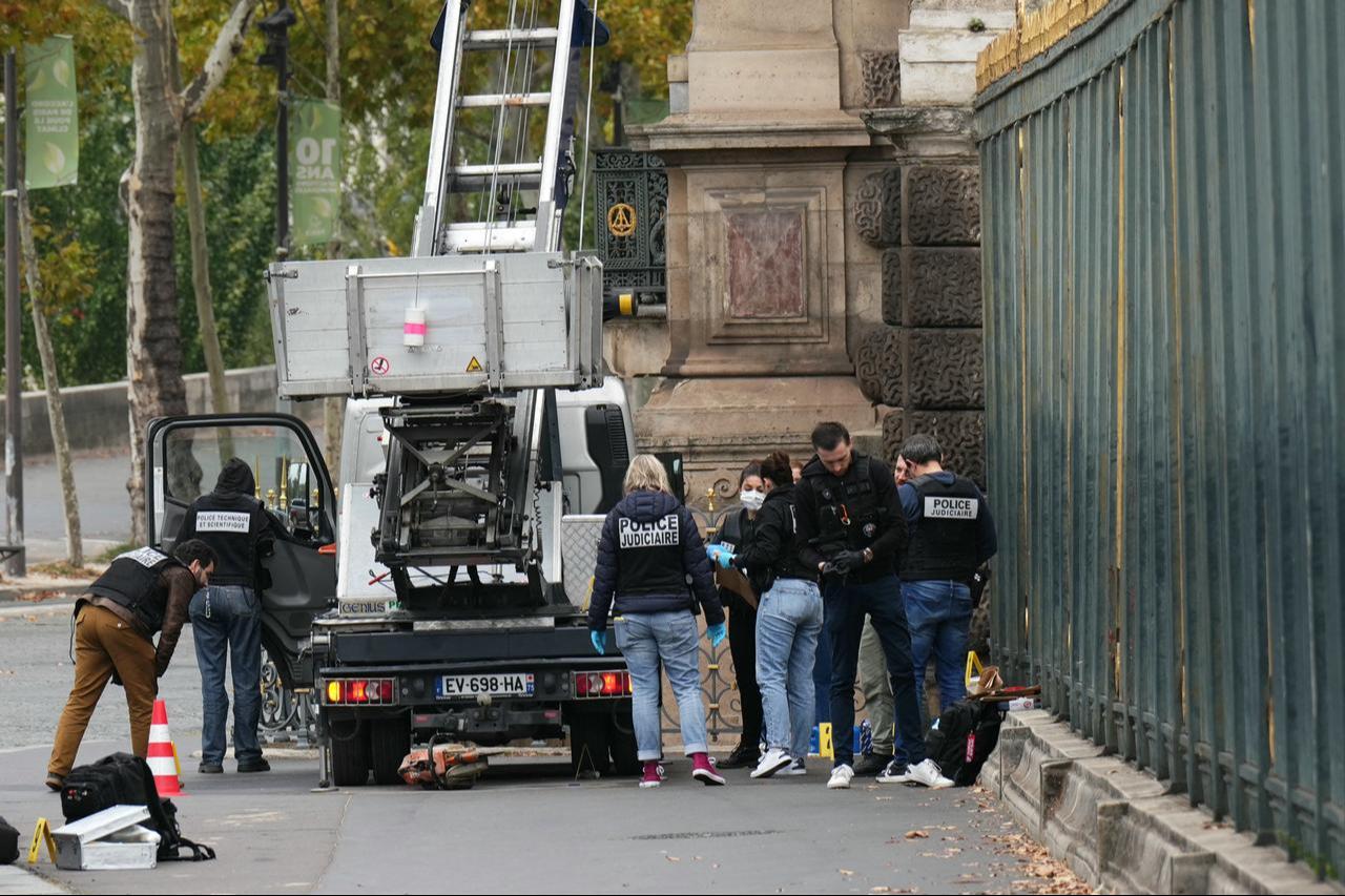 French police officers inspect a furniture elevator used by robbers to enter the Louvre Museum, on Quai Francois Mitterrand, in Paris on October 19, 2025. (AFP Photo)