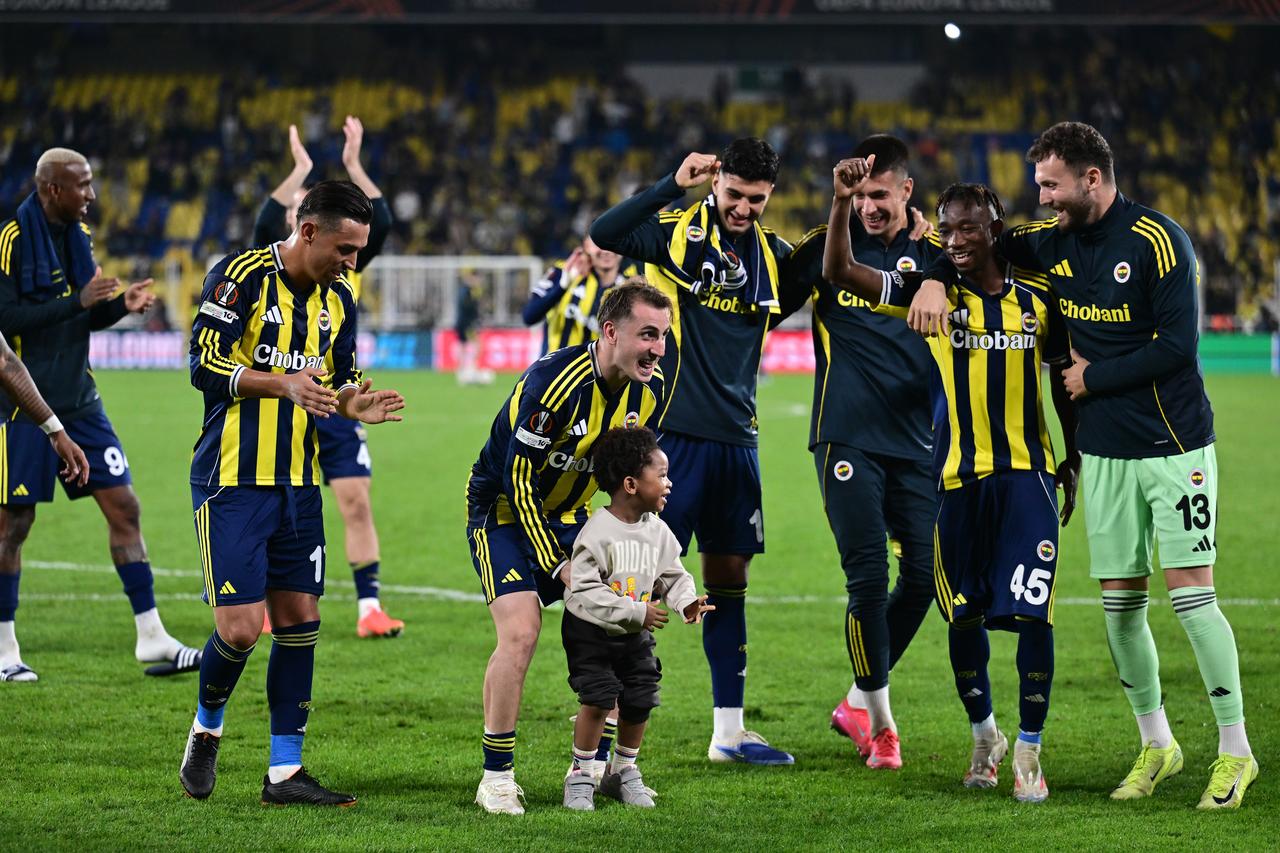 Players of Fenerbahce celebrate after UEFA Europa League football match between Fenerbahce and Nice at Chobani Stadium in Istanbul, Türkiye October 2, 2025. (AA Photo)