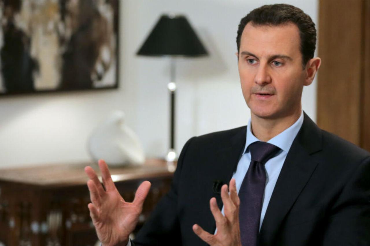 Syrian President Bashar al-Assad gestures during an exclusive interview with AFP in the capital Damascus , February 11, 2016. (AFP Photo)