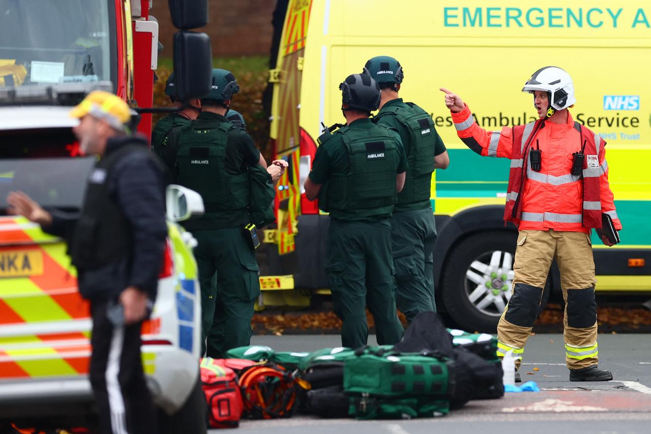Members of the Fire and Ambulance service are pictured inside a Police cordon near Heaton Park Hebrew Congregation synagogue following an incident at the synagogue in Crumpsall, north Manchester, on Oct. 2, 2025. (AFP Photo)