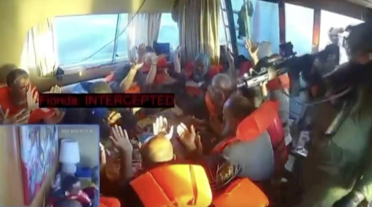 A screen grab shows activists aboard a Global Sumud Flotilla vessel raising their hands to prove they were unarmed in Mediterranean Sea, Oct. 02, 2025. (Photo via Global Sumud Flotilla)