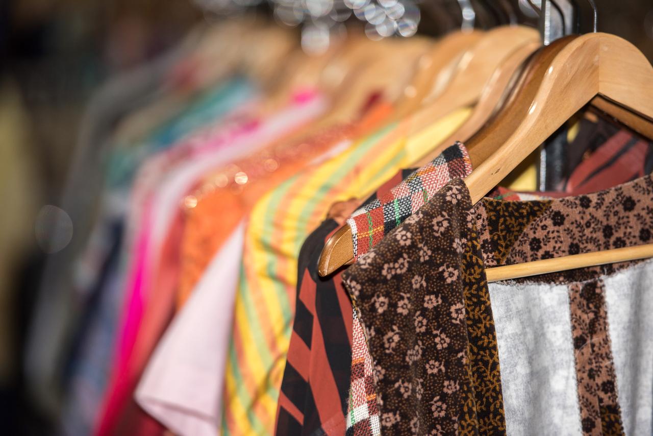 The shop offers a selection of vintage clothing for sale. (Adobe Stock Photo)