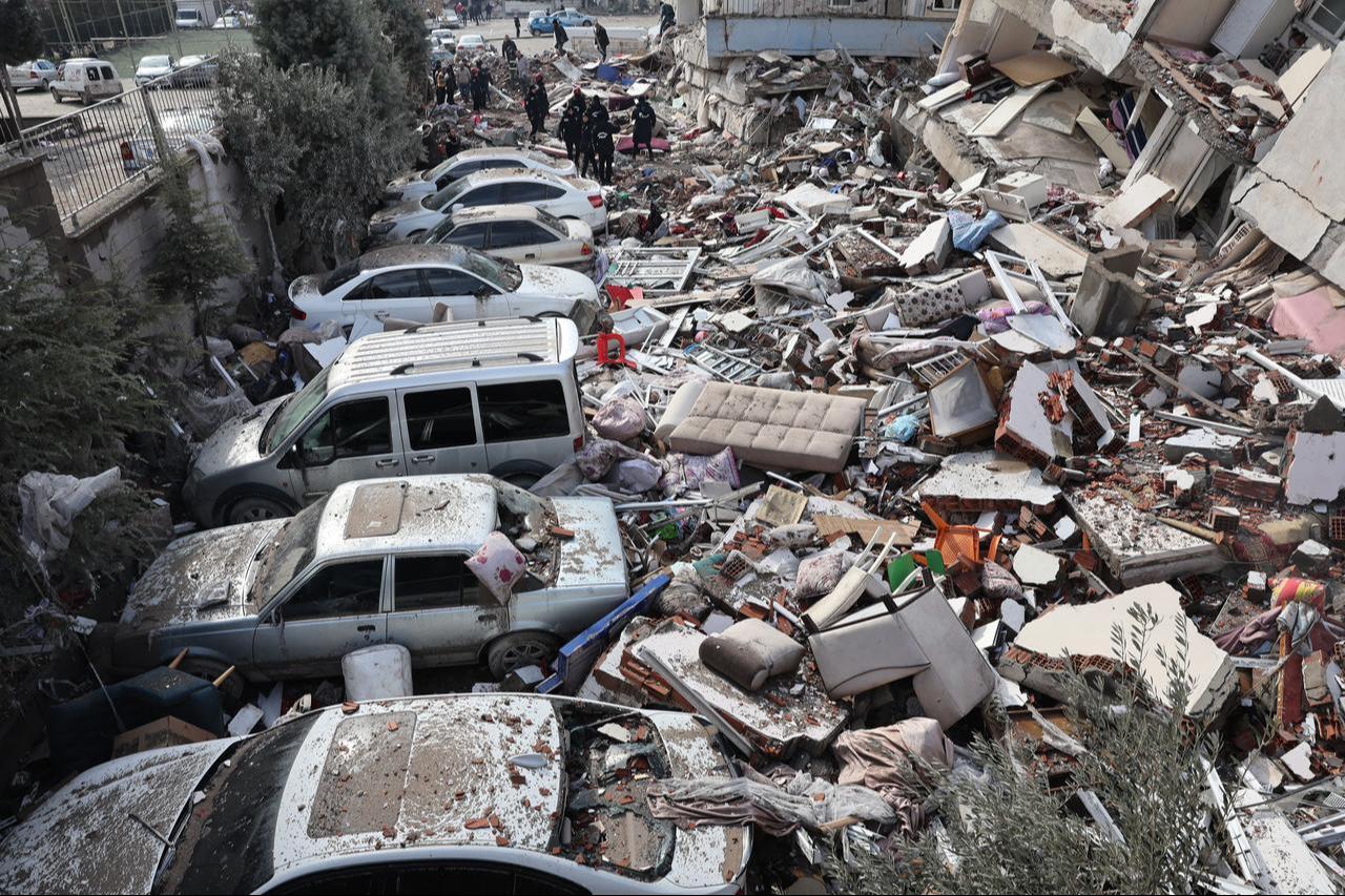 Vehicles are crushed under rubble of collapsed buildings in Kahramanmaras, close to quake's epicentre, day after a 7.8-magnitude earthquake struck the country's southeast, Feb. 7, 2023. (AFP Photo)