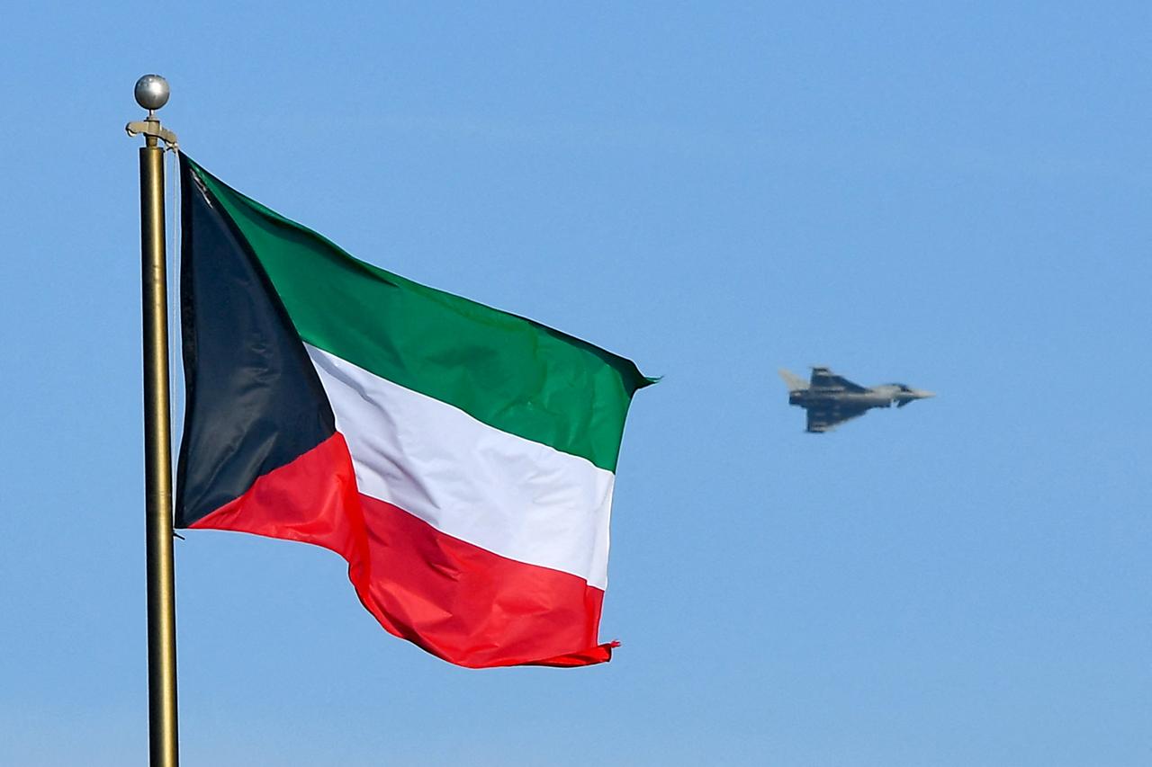 An Eurofighter Typhoon fighter jet is pictured behind Kuwait's flag in Kuwait City, Nov. 18, 2018. (AFP Photo)