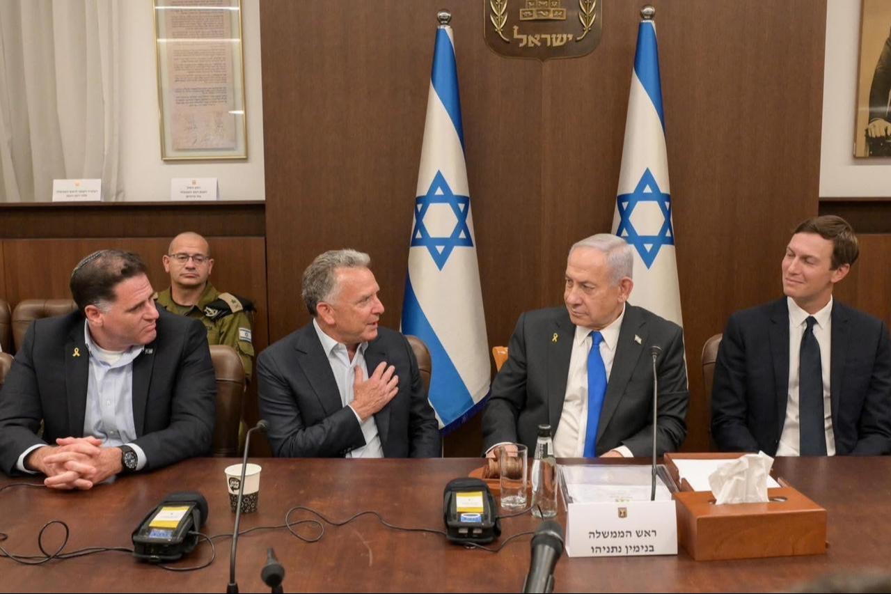 U.S. envoy Steve Witkoff (L) speaks with Israeli Prime Minister Benjamin Netanyahu (C) as Jared Kushner (R) looks on during the cabinet meeting in Al-Quds on Oct. 9, 2025. (Photo via X/@GPOIsrael)