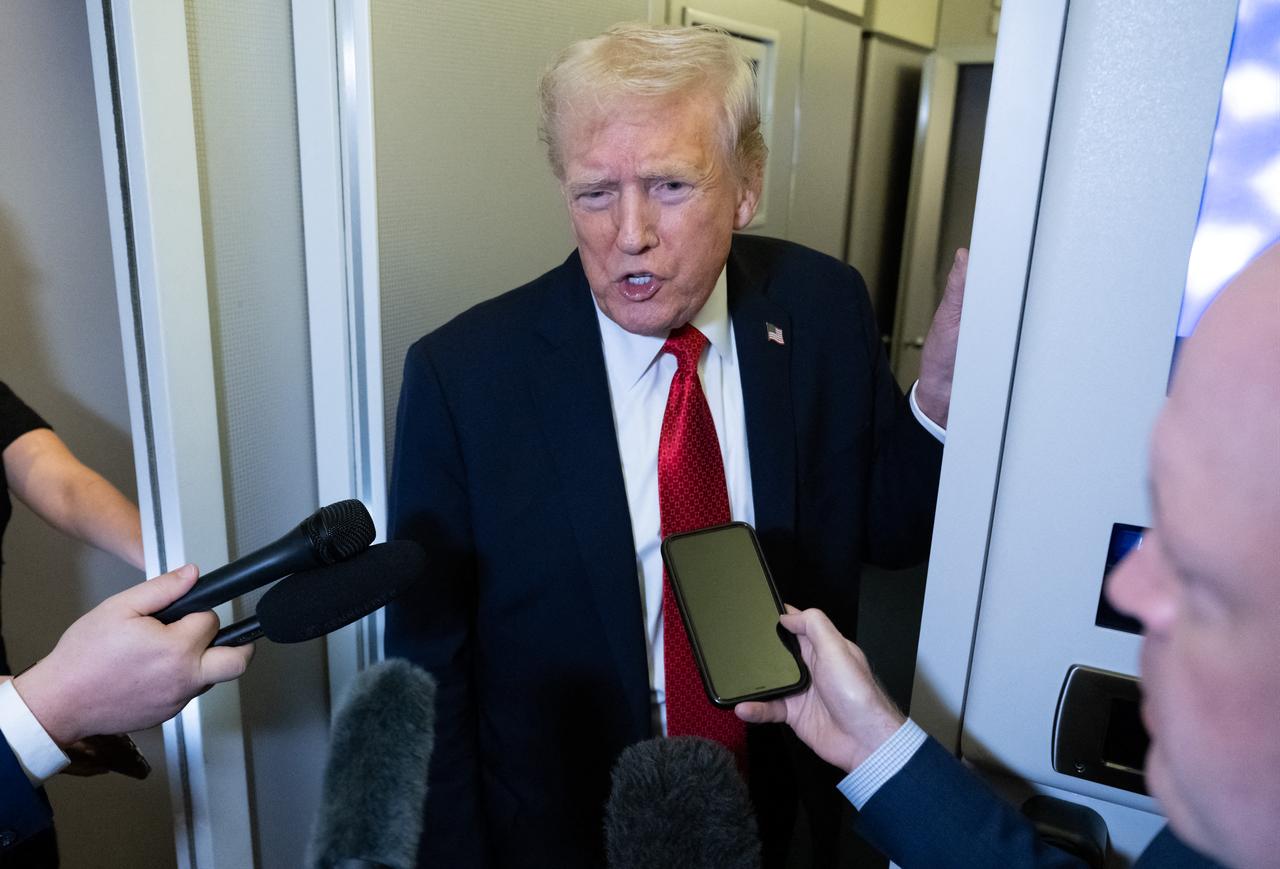 US President Donald Trump speaks with the media aboard Air Force One prior to landing at Joint Base Andrews in Maryland, October 19, 2025. (AFP Photo)