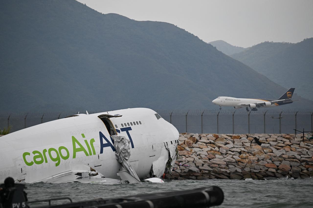Cargo plane veers off runway into sea at Hong Kong airport, 2 dead