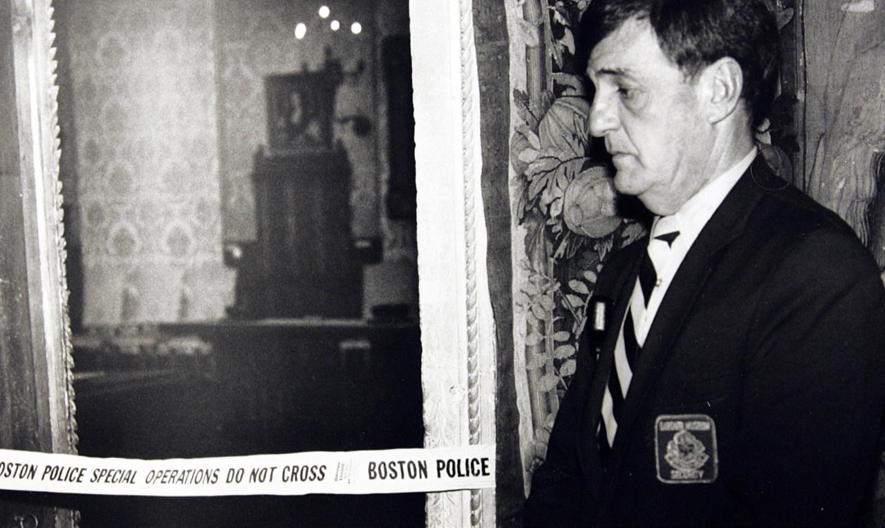 A security guard stands outside the Dutch Room of the Isabella Stewart Gardner Museum in Boston on 21 March 1990, where robbers stole more than a dozen works of art by Rembrandt, Vermeer, Degas, Manet and others. (Photo via The Guardian)