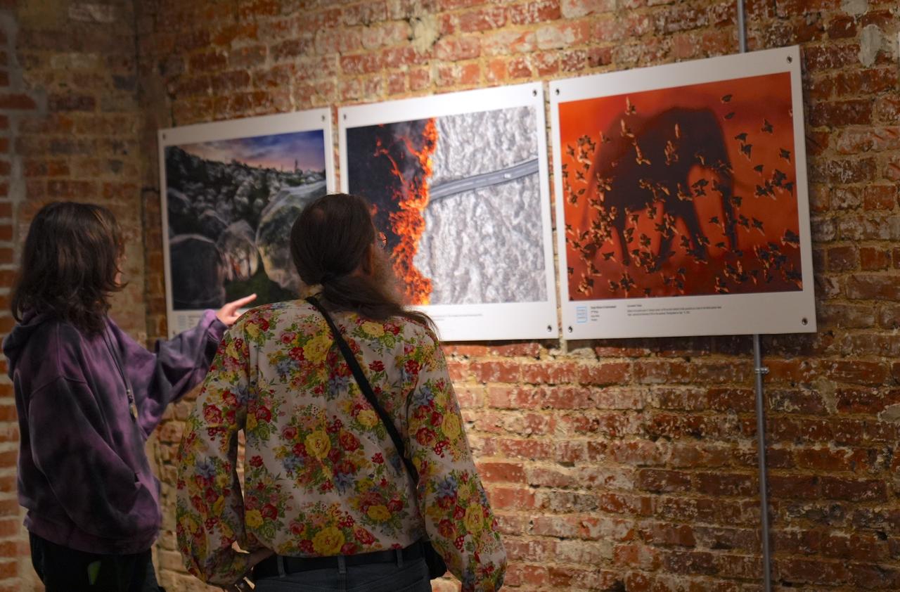 People visit the third exhibition of the "Istanbul Photo Awards 2025" international news photo competition organized by Anadolu at Blue Gallery in New York, United States, Oct. 20, 2025. (AA Photo)