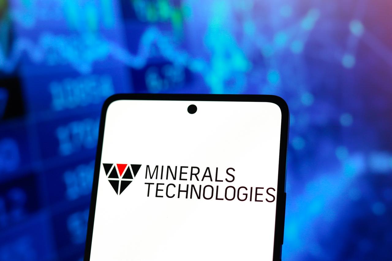 The logo of Minerals Technologies Inc. is displayed on a smartphone screen. (Adobe Stock Photo)