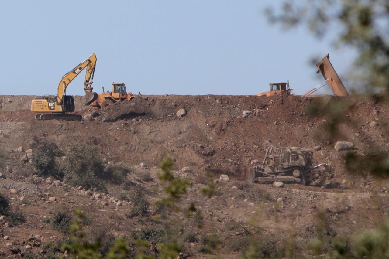 A view of the Israeli military posts established in the Quneitra region, along with construction equipment used during these operations, seen from Quneitra, Syria, Oct. 20, 2025. (AA Photo)