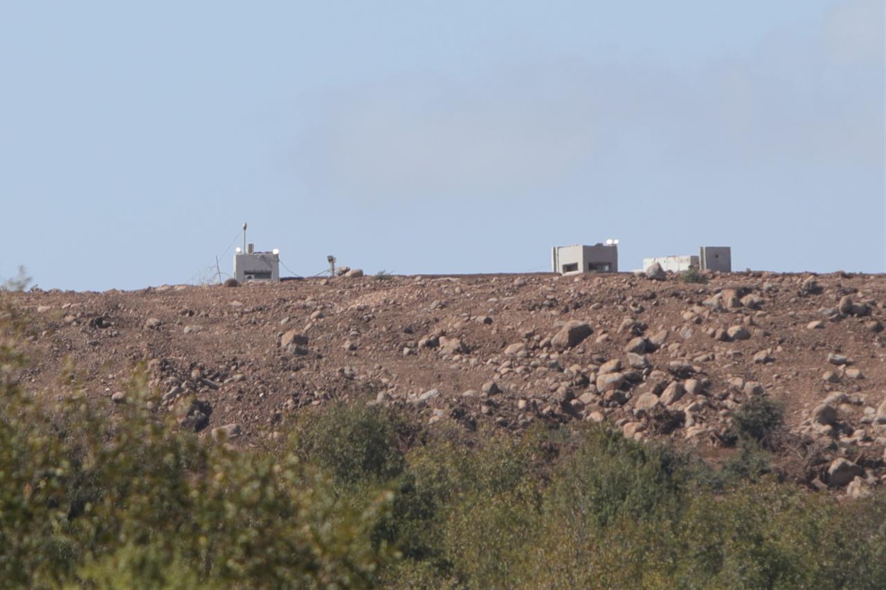 A view of the Israeli military posts established in the Quneitra region, along with the construction equipment used during these operations, seen from Quneitra, Syria Oct. 20, 2025. (AA Photo)