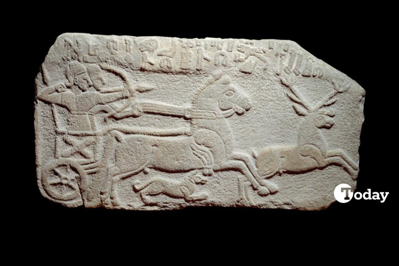 A relief depicting Hittite King Maradas hunting deer on a chariot, which was discovered in 1891 at Aslantepe Mound, listed on UNESCO's "Tentative List of World Heritage Sites," and is currently displayed at the Louvre Museum in France. (Photo collage by Türkiye Today team)