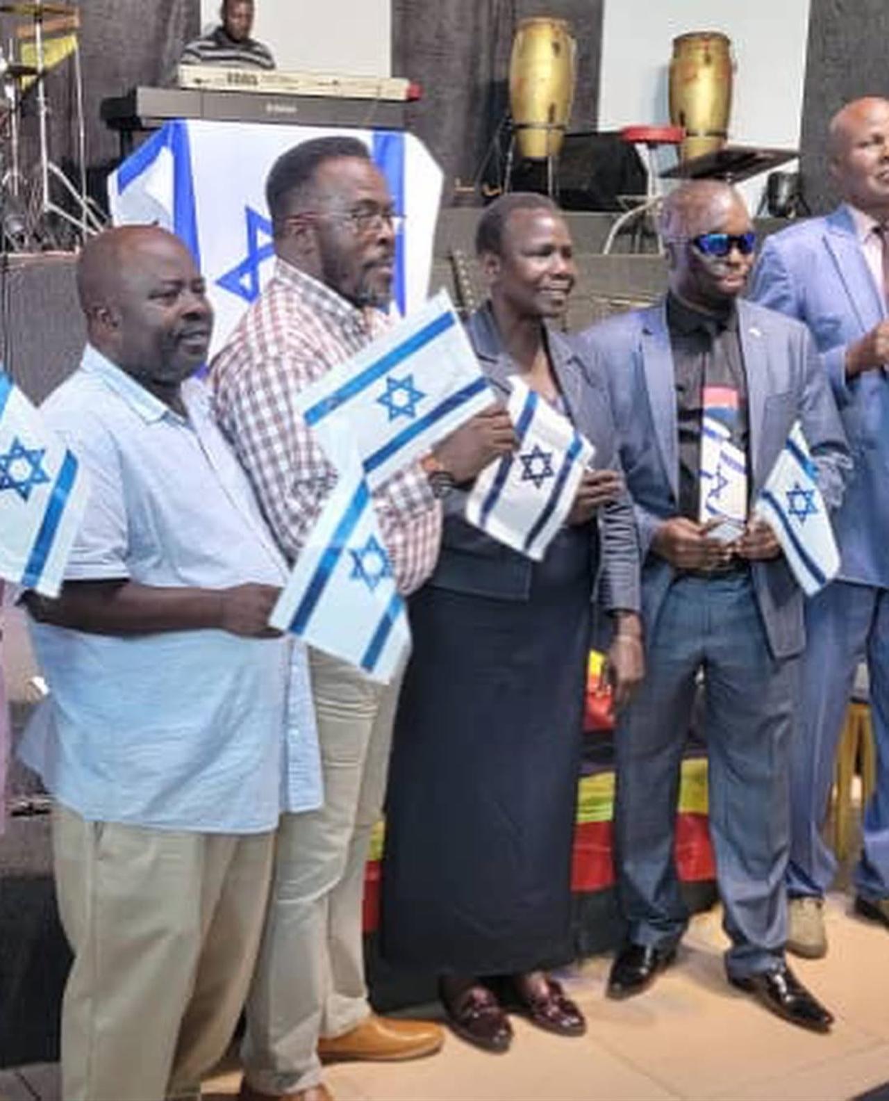 Kenyan citizens with Israeli flags. (Photo via @IsraelinKenya)