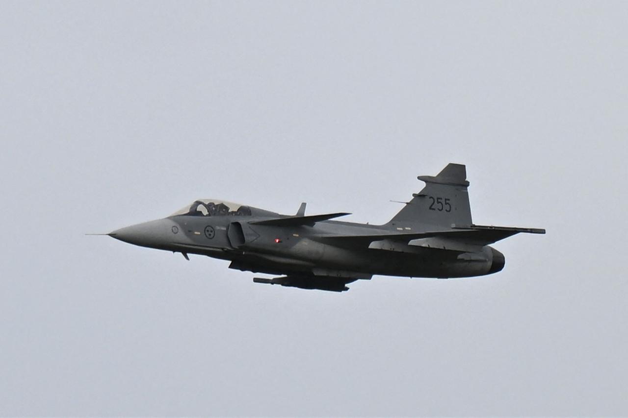 A Saab Gripen E-series fighter aircraft is seen in the sky over the airport of Linkoping, Sweden, as it is shown to the Ukrainian President during his visit, Oct. 22, 2025. (AFP Photo)