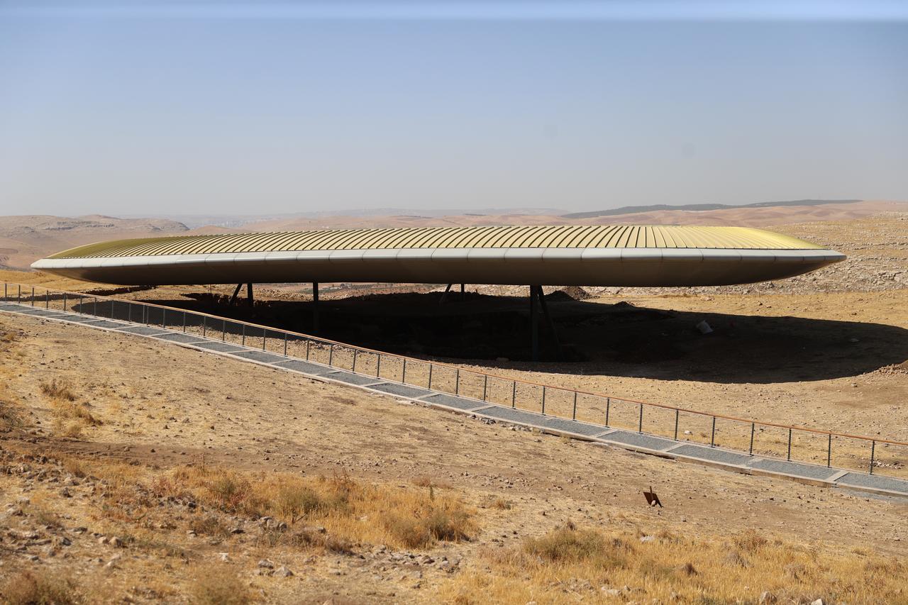 The newly built green-roofed GT2 shelter at Gobeklitepe stands ready to host visitors while excavations continue beneath it, blending protection with accessibility, Sanliurfa, Türkiye, Oct. 23, 2025. (AA Photo)