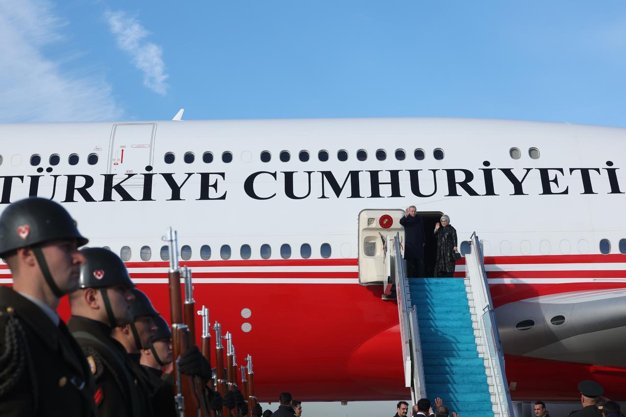 President Recep Tayyip Erdogan and his wife Emine Erdogan board the presidential plane before taking off for Kuwait in Istanbul, Türkiye, Oct. 21, 2025. (Photo via Turkish Presidency/Mustafa Kamaci)