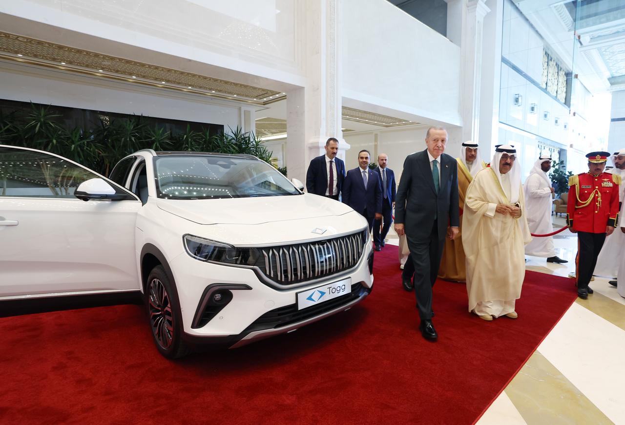 President Recep Tayyip Erdogan gifts Türkiye's domestic electric car Togg to the Emir of Kuwait, Mishal Al-Ahmad Al-Jaber Al-Sabah in Kuwait City, Kuwait, Oct. 21, 2025. (Photo via Turkish Presidency/Murat Cetinmuhurdar)