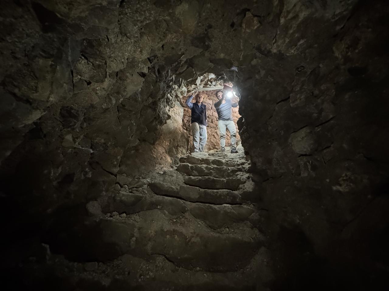Researchers illuminate the end section of Harput Castle’s restored Roman-era passage, which will soon open to visitors under tempered-glass protection, Oct. 23, 2025. (AA Photo)