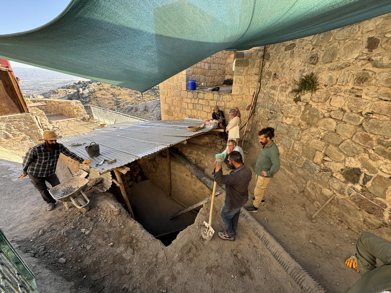 Archaeologists work at the entrance of the Roman-era secret passage discovered inside Harput Castle during the 17th excavation season, Elazig, Türkiye, Oct. 23, 2025. (AA Photo)