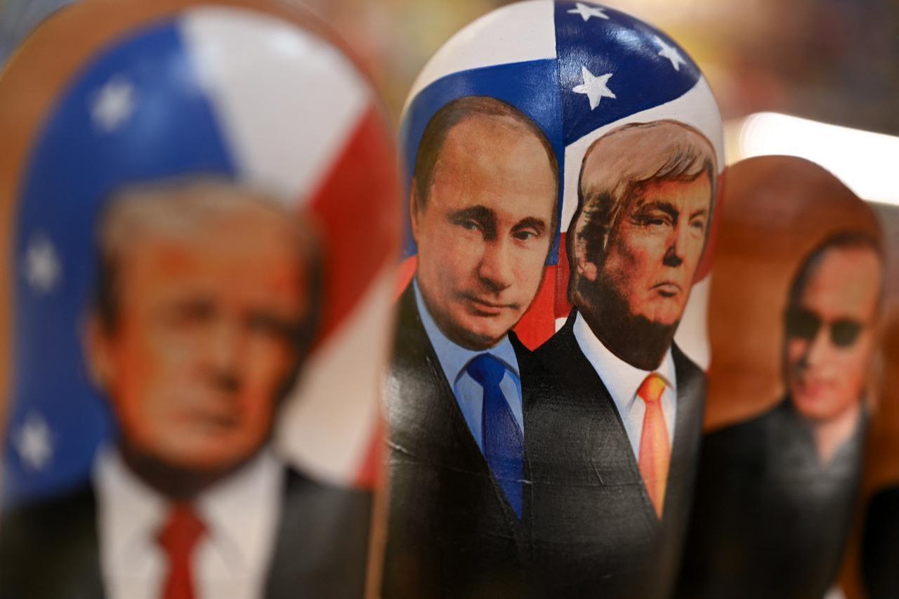 Traditional Russian wooden nesting dolls, Matryoshka dolls, depicting Russian President Vladimir Putin and US President Donald Trump are displayed for sale at a gift shop on the touristic Arbat street in downtown Moscow on Oct. 21, 2025. (AFP Photo)