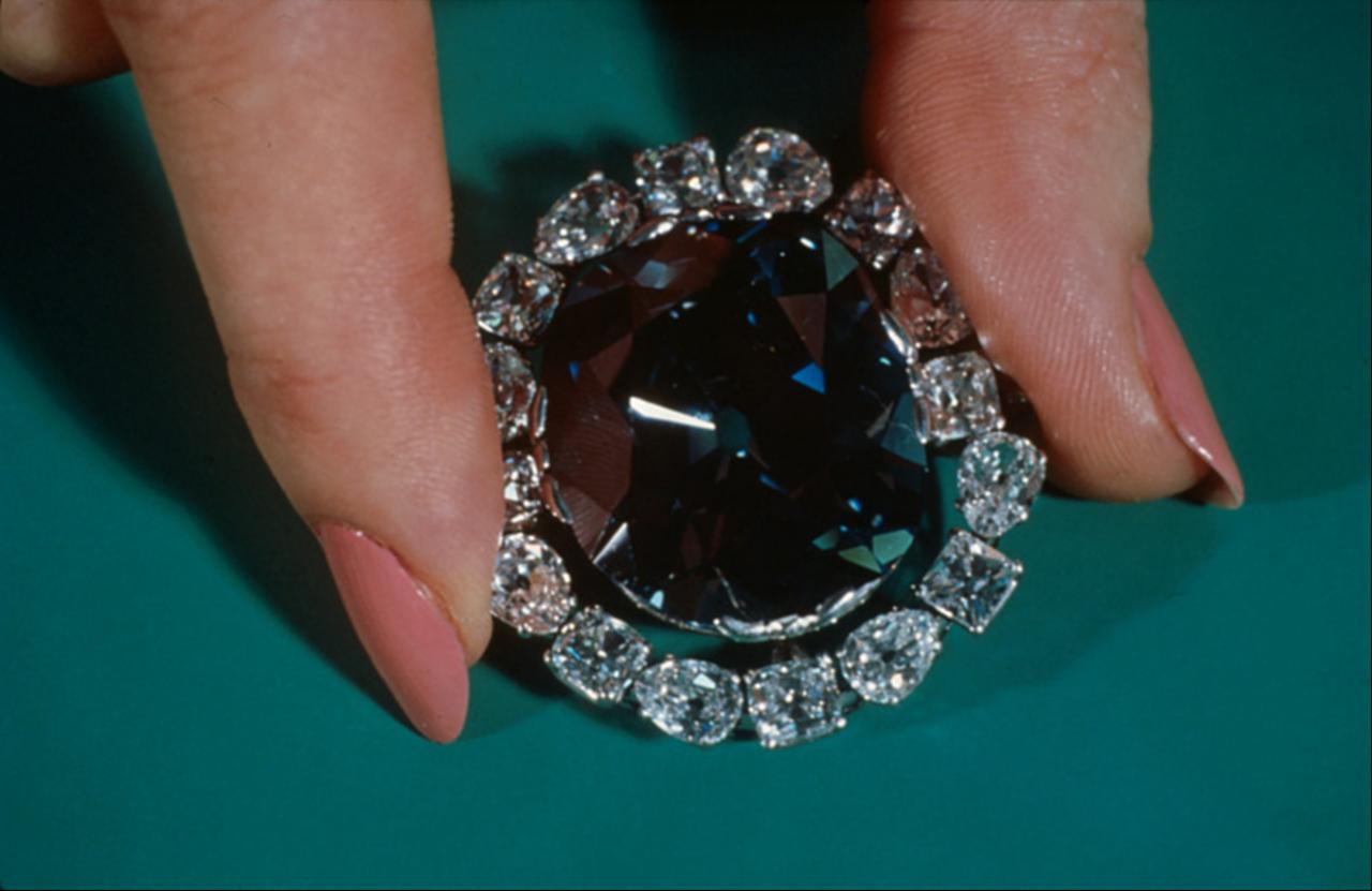 A close-up view of the 45.52-carat deep-blue diamond surrounded by white stones before its display at the Smithsonian. (Photo via Smithsonian Institution archives)