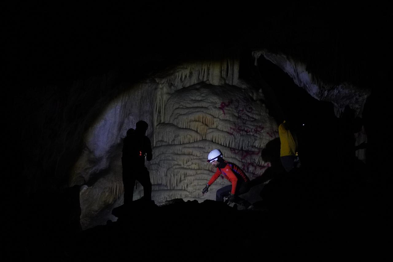Explorers use headlamps to navigate deep sections of Kuneba Cave in Sulaymaniyah, Iraq, Oct. 24, 2025. (AA Photo)
