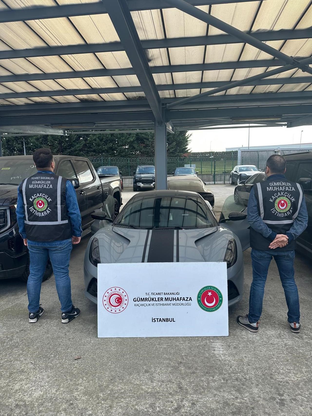 Officers from Ministry of Commerce's Istanbul Customs Protection Smuggling and Intelligence Department displays the captued luxury vehicle after operations, October 23, 2025. (IHA Photo)