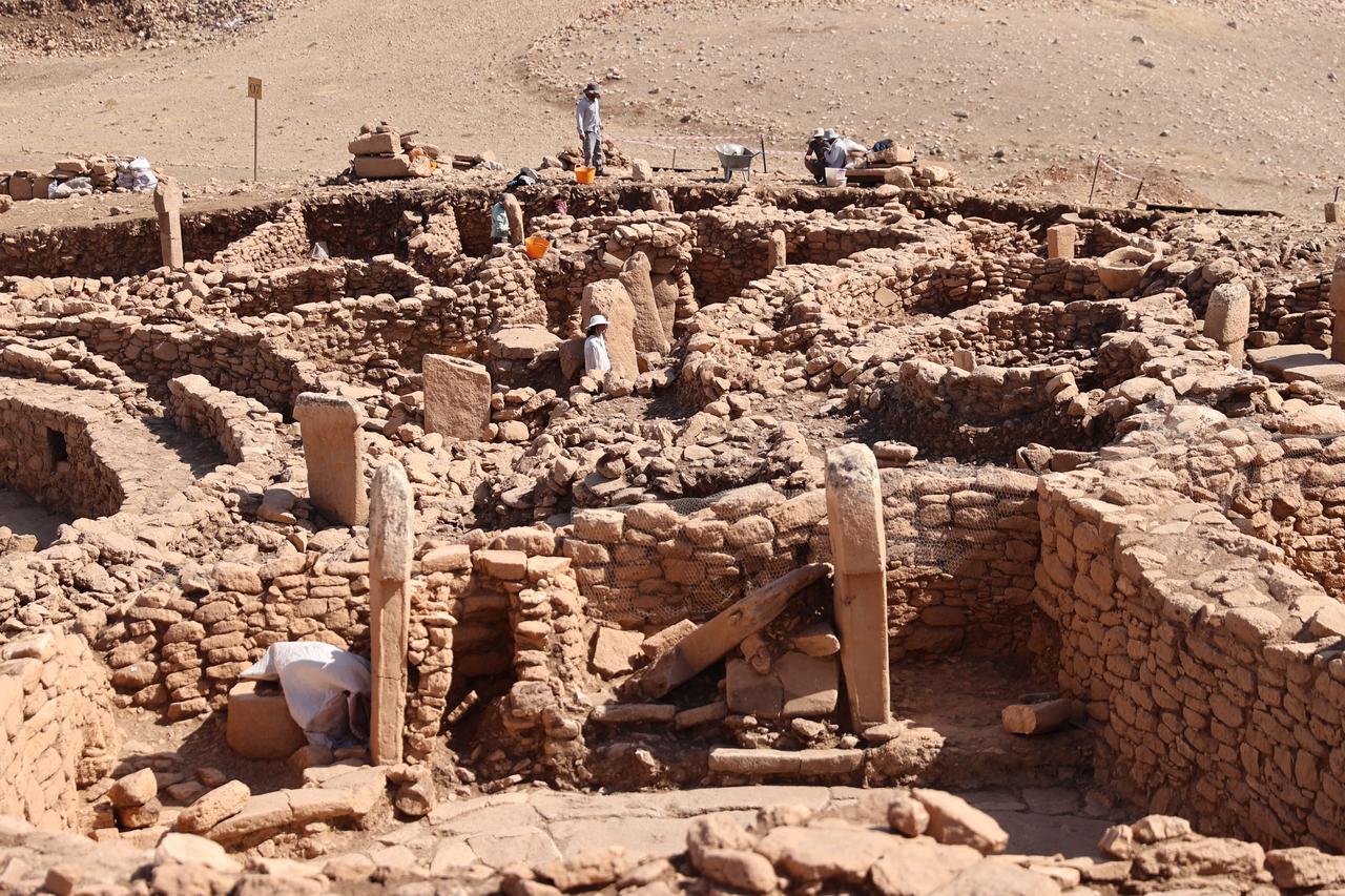 General view of the excavation area at Karahantepe, showing tightly built stone structures surrounding large T-shaped pillars. (AA Photo)