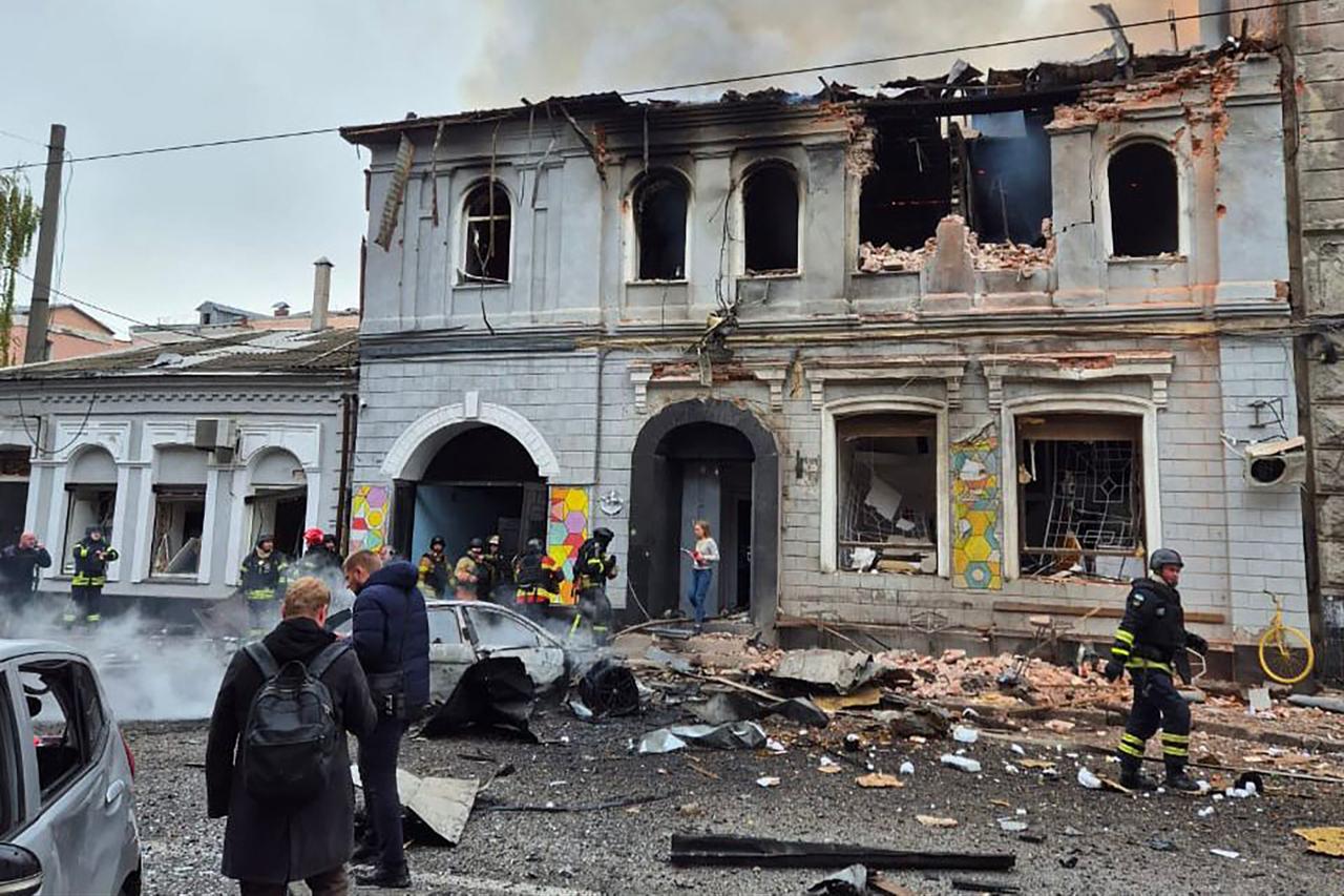 Ukrainian law enforcement officers work at the site of a drone attack that hit a kindergarten in Kharkiv, October 22, 2025. (Photo by Handout /Ukrainian Emergency Service/AFP)