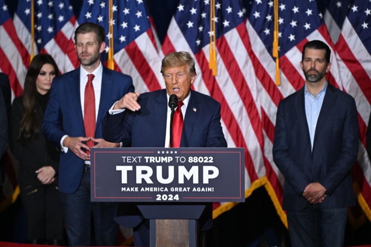 US President Donald Trump, with sons Eric (2nd L) and Donald (R), speaks at a watch party during the 2024 Iowa Republican presidential caucuses in Des Moines, Iowa, US, on Jan. 15, 2024. (AFP Photo)