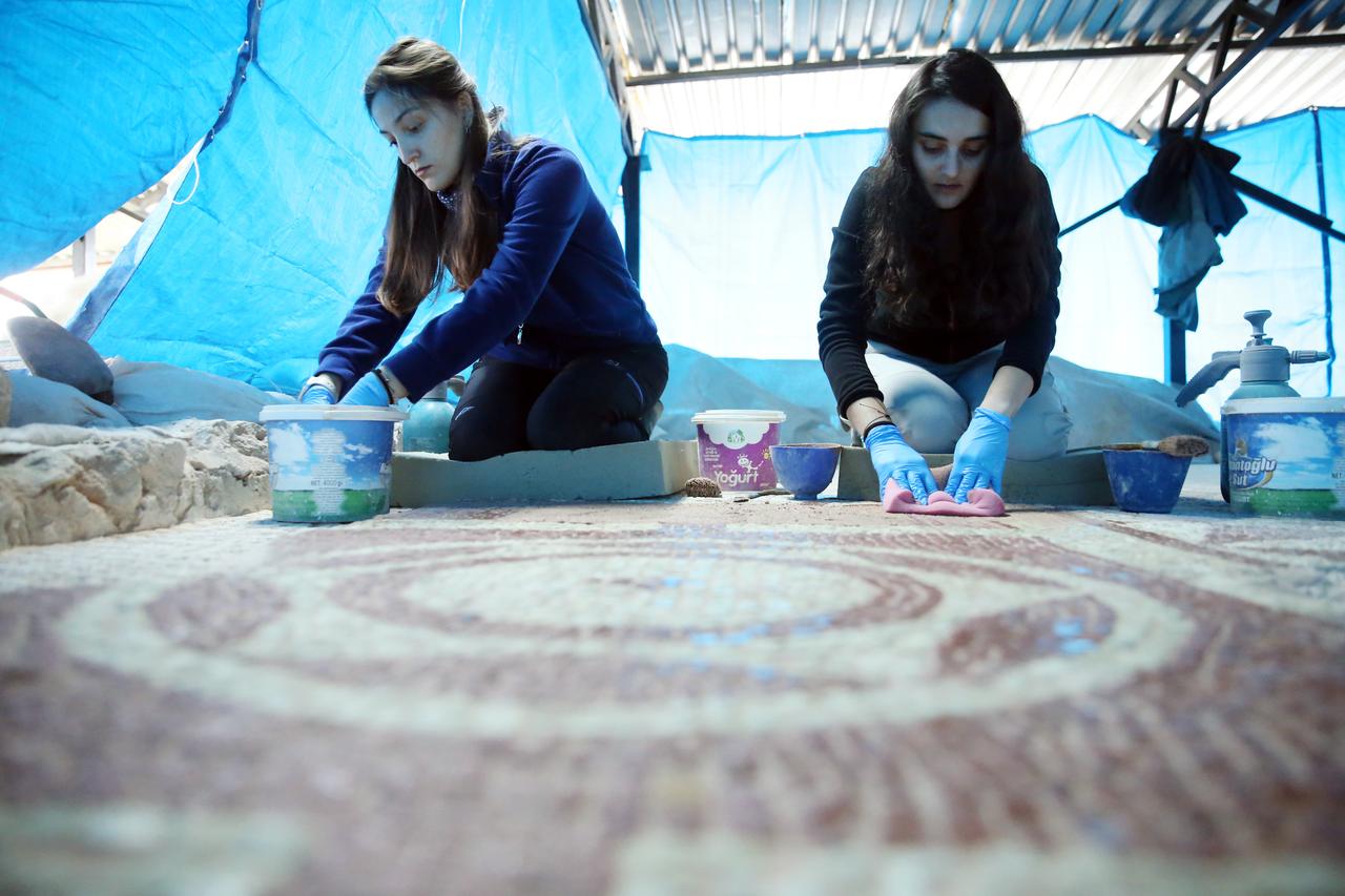 Restoration experts clean mosaic floors discovered in a Roman villa at Pompeiopolis, part of the Ministry of Culture and Tourism’s “Heritage for the Future” project. (AA Photo)