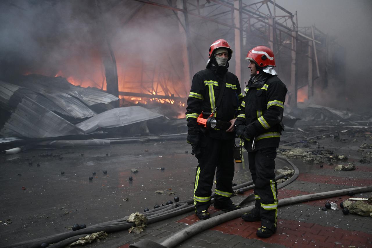 Ukrainian firefighters work at the site of a food warehouse following a Russian missile strike in Kyiv early on October 25, 2025. (AFP Photo)