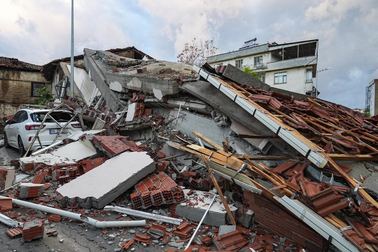 A general view shows the collapsed building after a 6.1 magnitude earthquake struck in the Sindirgi district at 22:48 local time in Balikesir, Türkiye, on Oct. 28, 2025. (AA Photo)